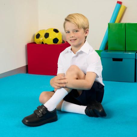 Boy wearing uniform and Skechers school shoes