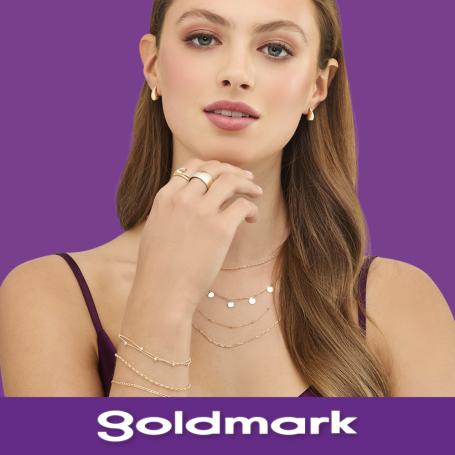 Woman wearing Goldmark jewellery