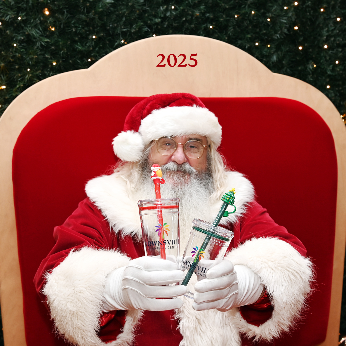 Santa holding Christmas Keep Cups